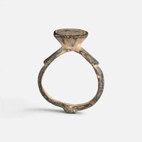 Byzantine bronze ring 'Damianos' shows its raised bezel neck and complete hoop in profile.