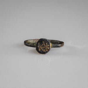 Byzantine bronze signet ring Kyriakos with engraved monogram on octagonal bezel, front view