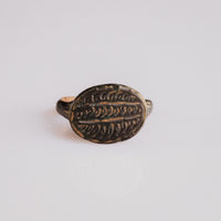 Byzantine bronze signet ring Theodoros with herringbone-engraved oval bezel, top view