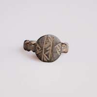 Byzantine bronze signet ring Theodulos with incised herringbone bezel, top view