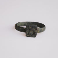 Byzantine bronze signet ring Zosimos with engraved quadruped and star on square bezel