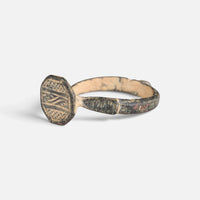 Byzantine bronze ring 'Damianos' shows its engraved octagonal bezel from the opposite front angle.