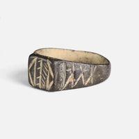Byzantine bronze ring 'Ioanna' shows its geometric bezel and shoulder from the opposite front angle.