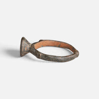 Byzantine bronze ring 'Monogrammos' shows its raised bezel edge and hoop from the opposite side.