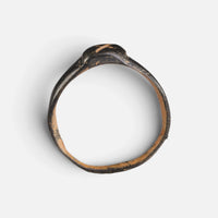 Byzantine bronze ring 'Isidoros' shows its complete hoop and small bezel edge from the opposite profile.