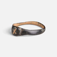 Byzantine bronze ring 'Isidoros' shows its X-shaped bezel mark from the opposite front angle.