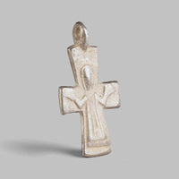 Byzantine silver cross pendant Peristeria with orant figure in low relief, three-quarter view