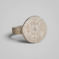 Byzantine silver ring Klados, close view of disc face and slight rim notch.