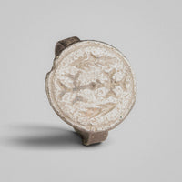 Byzantine silver ring Klados, top-down view of intaglio device with central shaft and paired fronds.