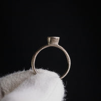 Byzantine silver ring Iesous upright on dark background revealing hoop silhouette