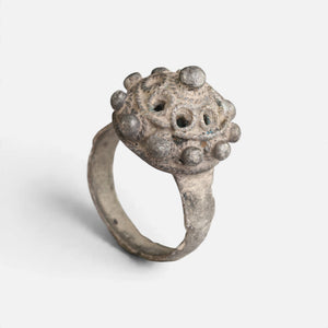 Byzantine silver ring 'Thalios' shows its pierced domed bezel and complete hoop at an angle.