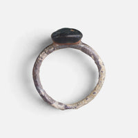 Byzantine ring 'Theodosia' shows the edge of its disc bezel above the complete hoop in profile.
