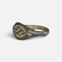 Medieval bronze ring 'Aldhelm' shows its engraved navette bezel and hoop from the opposite angle.