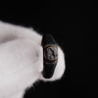 Close-up of engraved bird motif on Roman bronze ring Numerius bezel