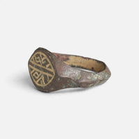 Medieval bronze ring 'Radwin' shows its engraved navette bezel and hoop from the opposite angle.