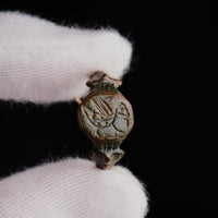 Close-up of medieval bronze ring Vukasin bezel showing engraved bird facing a plant motif