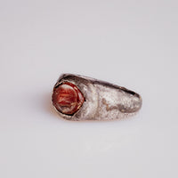 Close-up of Roman silver ring Pisculus carnelian intaglio engraved with fish
