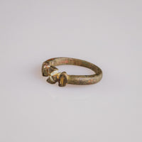 Close-up of the cast cross pattée bezel on medieval bronze ring Cruciata