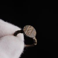 Close view of Byzantine bronze ring Theodulos highlighting bezel geometry and patina