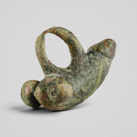 Close view of Roman bronze pendant 'Felix' showing spherical terminal knob and secondary protrusion