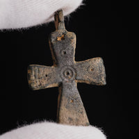 Detail of Byzantine bronze cross pendant Phanourios, close-up of central concentric circle stamp