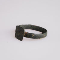 Detail of Byzantine bronze ring Zosimos bezel with quadruped, six-pointed star and incised line