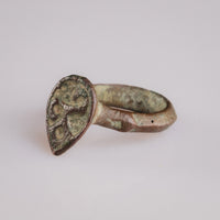 Detail of engraved bezel on medieval bronze ring Vetka showing Lebensbaum motif