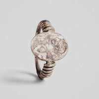 Detail of Roman silver ring Veneria intaglio plate with worn draped bust profile