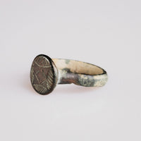 Detail of medieval bronze ring 'Aldric' bezel with lozenge and hatched petal motif