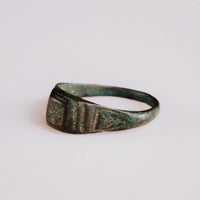 Detail of Roman bronze ring Numerius shoulders with parallel diagonal incised grooves