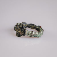 Detail view of medieval bronze ring Quintus highlighting the quincunx ring-and-dot bezel