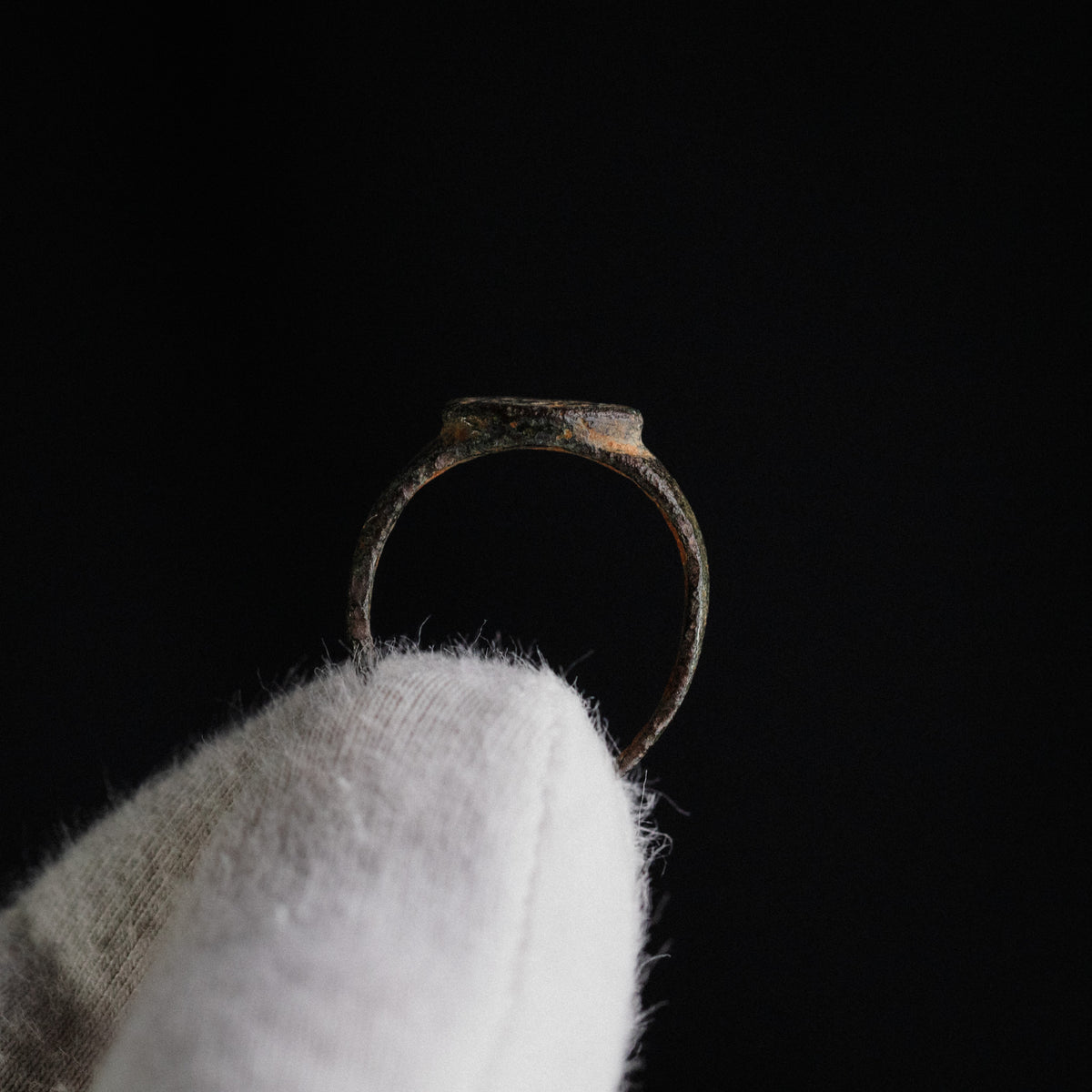 Elevation view of Byzantine bronze ring 'Theodora' showing raised bezel and thin band