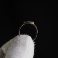 Elevation view of Byzantine bronze ring 'Theodora' showing raised bezel and thin band