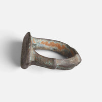Roman bronze ring 'Catulla' shows its bezel edge and ridged hoop from the opposite side.