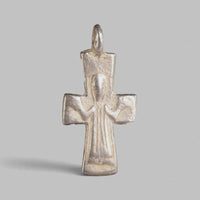 Front view of Byzantine silver pectoral cross Peristeria showing standing orant figure and flared arms