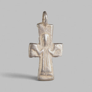Front view of Byzantine silver pectoral cross Peristeria showing standing orant figure and flared arms