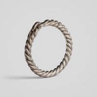 Front view of medieval silver ring Hravnar with tight helical twist around the full hoop