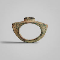 Front view of Roman bronze ring 'Tullia' with thin D-section hoop and raised bezel