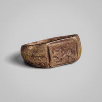 Front view of Roman silver ring 'Leontia' with cast bezel and encrusted surface