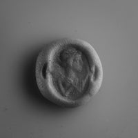 Putty impression of the intaglio on Roman silver ring Veneria, showing the draped bust in profile