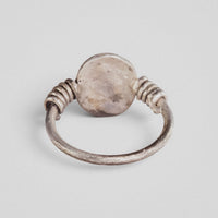 Roman silver ring Veneria showing the plain reverse of the oval plate between the coiled shoulders