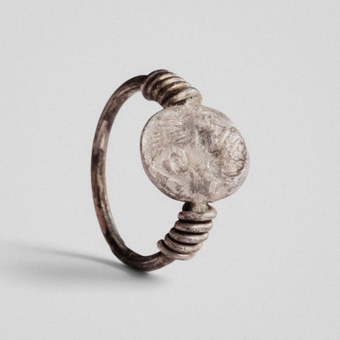 Roman silver ring Veneria with an engraved draped bust, most likely Venus, and coiled wire shoulders, three-quarter view