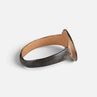 Byzantine bronze ring 'Okellina' shows its thin oval bezel edge and broad hoop from the side.