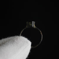 Interior hoop view of Byzantine bronze ring Kyriakos showing bezel profile against dark ground