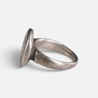 Byzantine silver ring 'Chrysanthos' shows its bezel edge and tapering hoop from the opposite side.