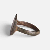 Medieval bronze ring 'Anselm' shows its octagonal bezel edge and hoop from the opposite side.