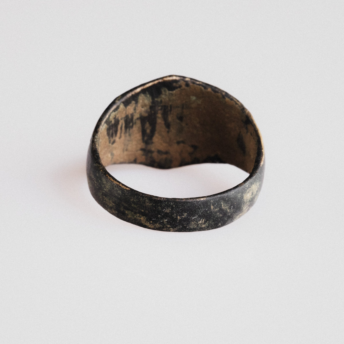 Interior view of medieval bronze ring Astariel showing worn copper-alloy metal