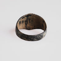 Interior view of medieval bronze ring Astariel showing worn copper-alloy metal