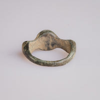 Interior view of Roman bronze ring Corvidus showing hoop shape and earthy encrustation