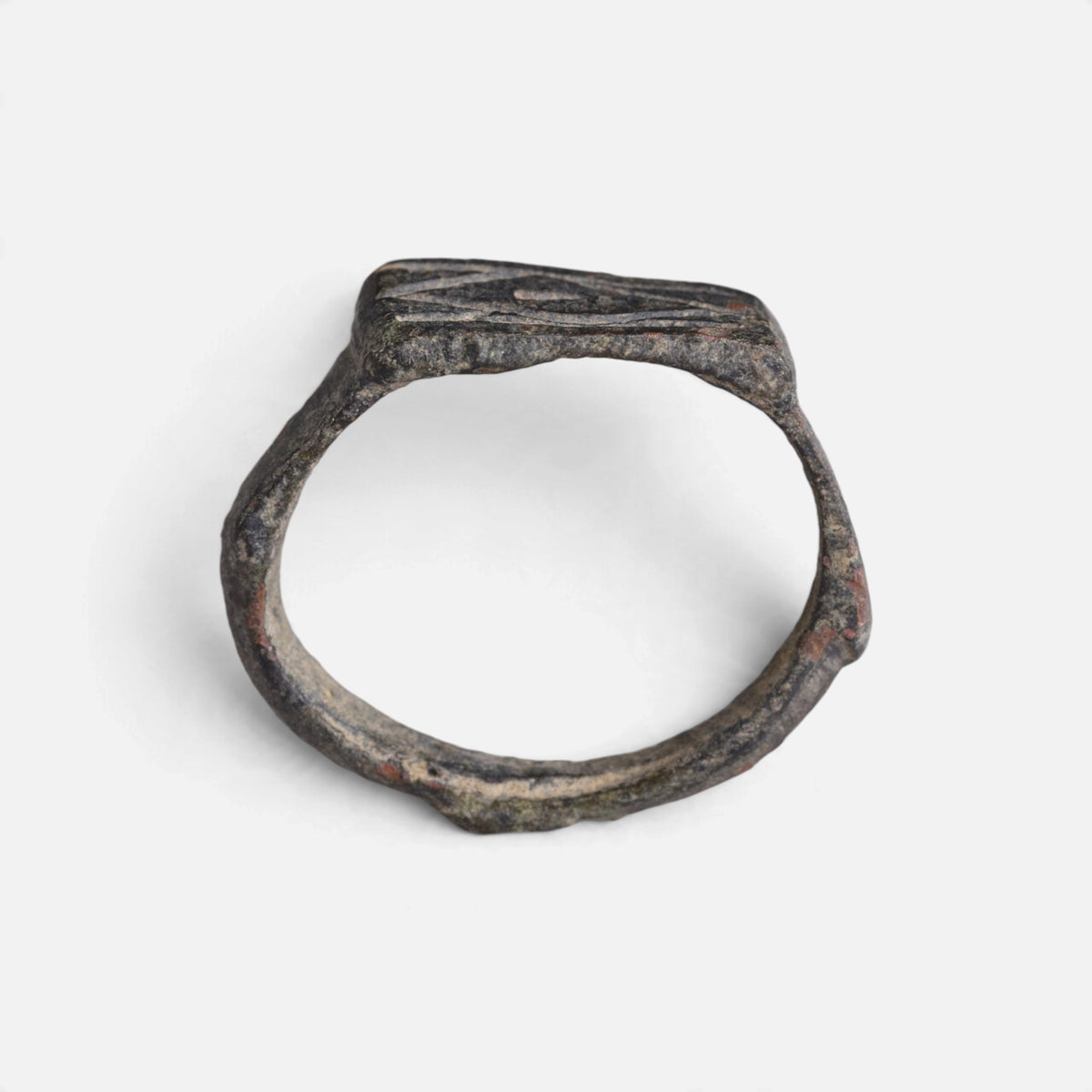 Roman bronze ring 'Lucina' shows its full hoop and the flat rectangular bezel edge in profile.